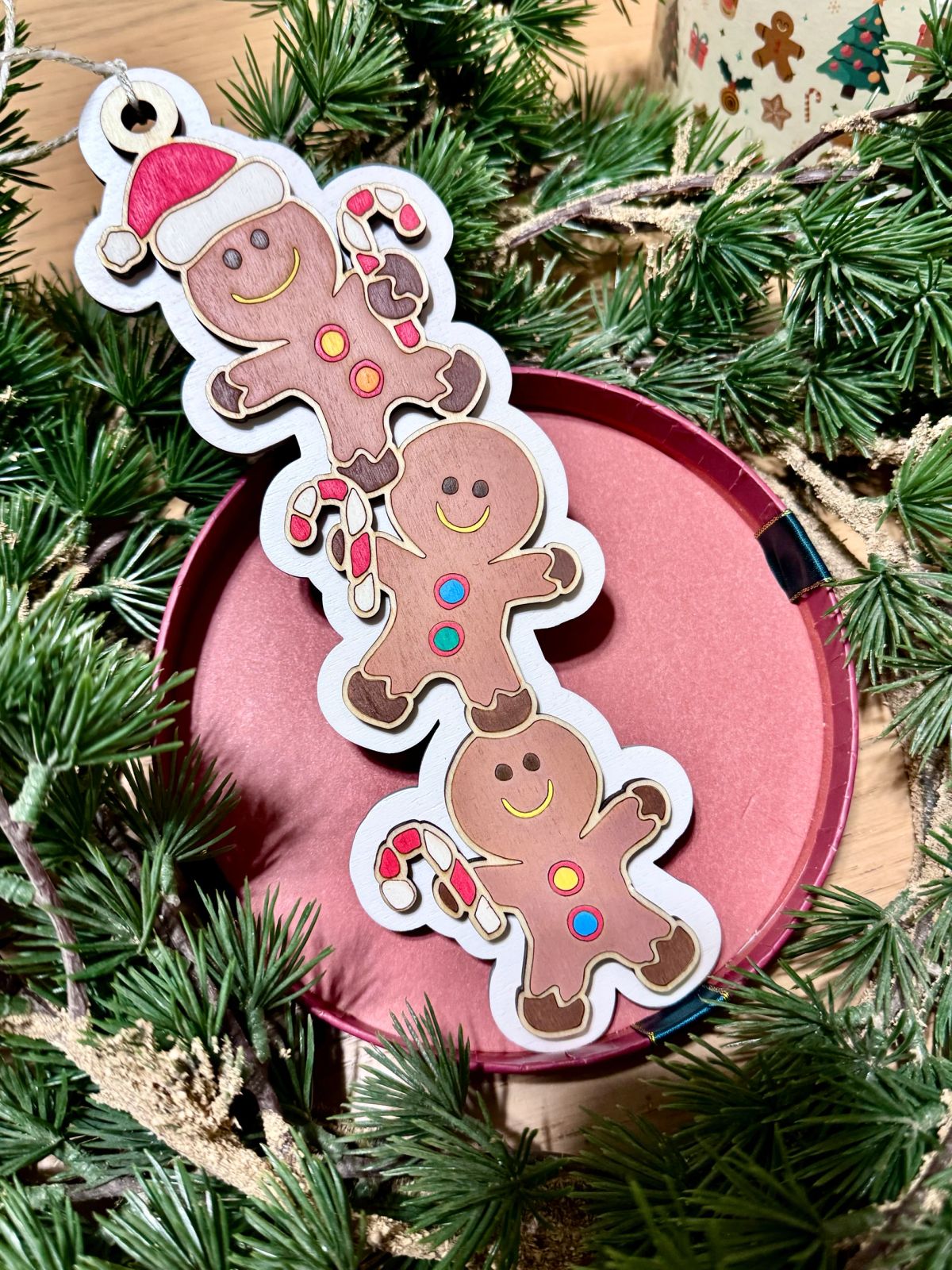 Rustic Gingerbread Man Ornaments on Pine Garland Rustic Gingerbread Man Ornaments on Pine Garland — Gingerbread Christmas Decor