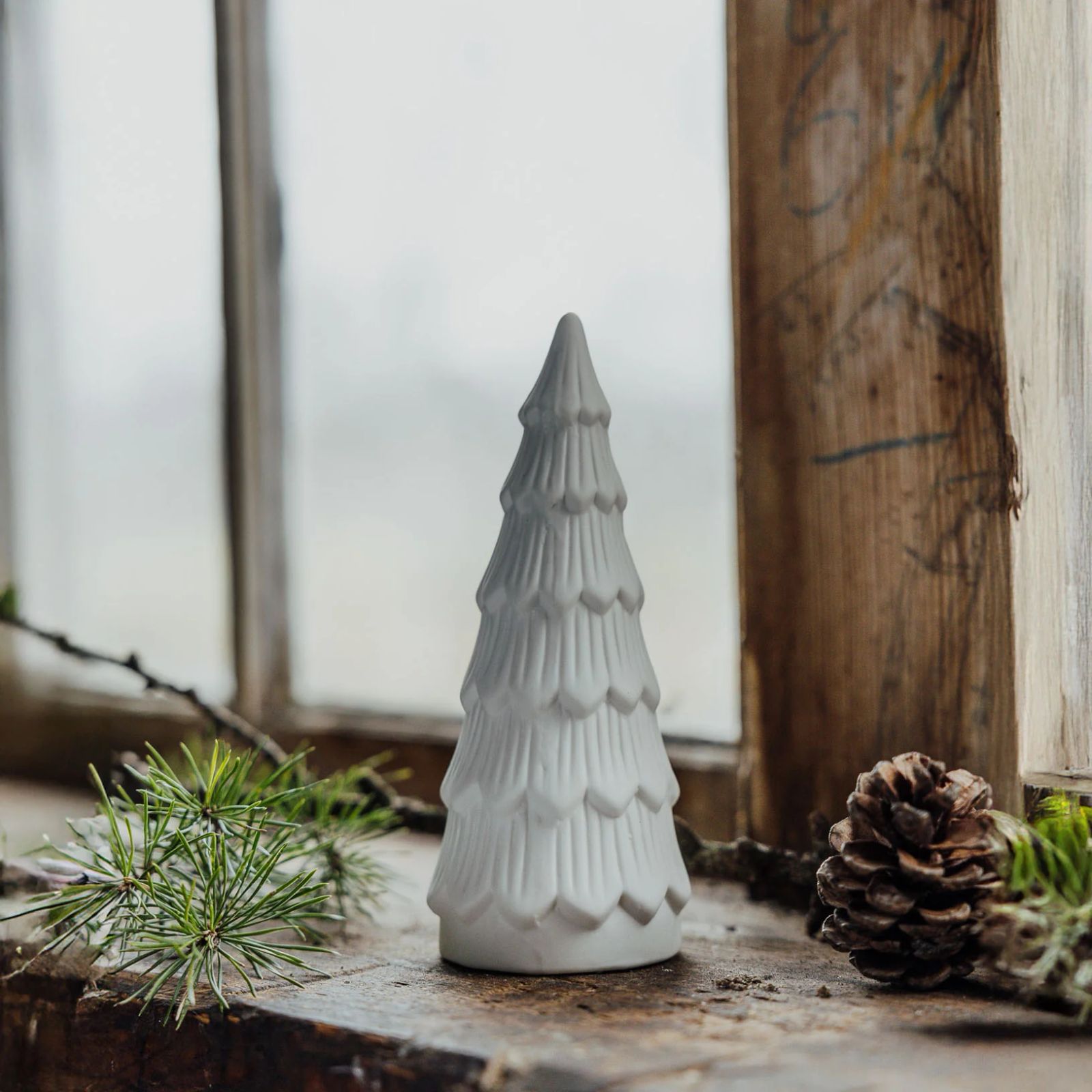 Rustic White Ceramic Christmas Tree on a Wooden Surface Rustic White Ceramic Christmas Tree on a Wooden Surface — White Christmas Tree Decor