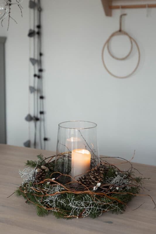 Natural Wreath Candle Holder on a Wooden Table — Winter Decor After Christmas