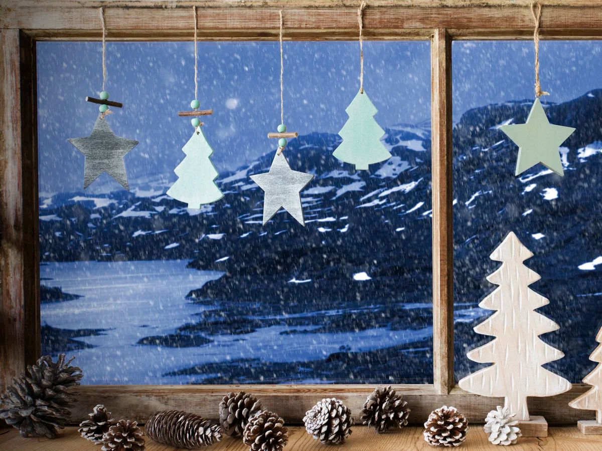 Rustic Wooden Trees Hanging by a Window Rustic Wooden Trees Hanging by a Window — Small Christmas Tree Decor