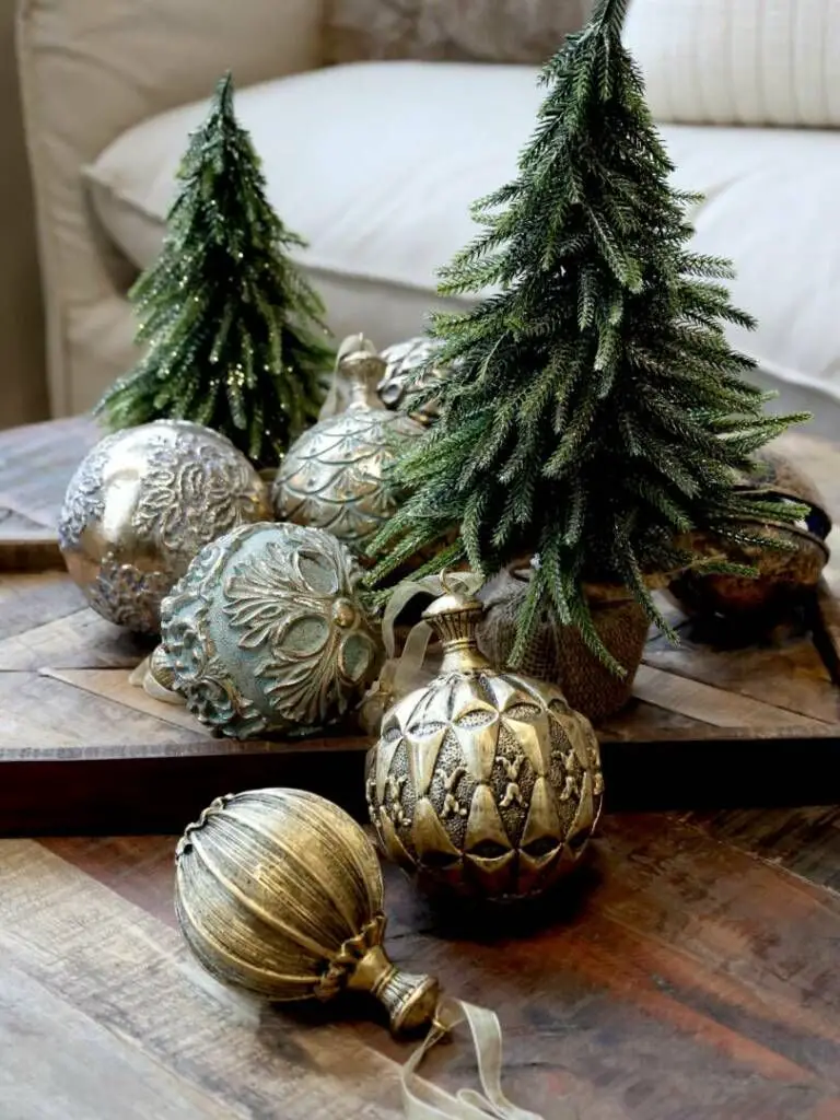 Elegant Tabletop Vignette with Gold Ornaments and Mini Trees — Christmas Bathroom Decor