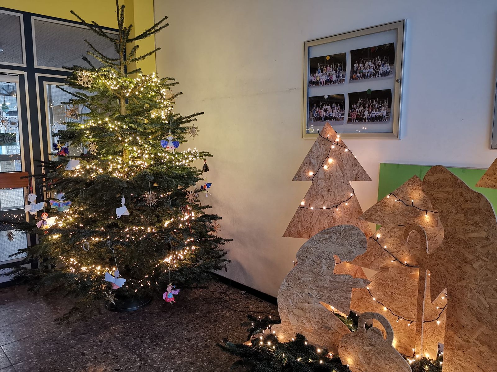 Illuminated Christmas Tree and Nativity Scene in Hallway Illuminated Christmas Tree and Nativity Scene in Hallway — Christmas Classroom Decor